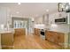 Open concept kitchen with stainless appliances, granite countertops, and a view to a lakefront deck and backyard at 449 Windward Dr, Davidson, NC 28036