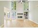 Bright and modern living room boasts soaring ceilings, a fireplace, and scenic views of the water at 449 Windward Dr, Davidson, NC 28036