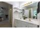 Bathroom featuring a double sink vanity and access to the main bedroom at 4637 Willow Glen Rd, Harrisburg, NC 28075