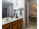 Bathroom featuring a single sink vanity and an open doorway that leads to the bedroom at 4637 Willow Glen Rd, Harrisburg, NC 28075