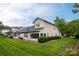 Well-maintained exterior showing a green lawn, mature trees, and a peaceful environment at 4637 Willow Glen Rd, Harrisburg, NC 28075