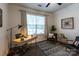 Bright home office with a modern desk, comfortable seating, and neutral decor at 4637 Willow Glen Rd, Harrisburg, NC 28075