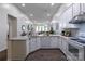 Spacious kitchen with white cabinetry, granite countertops, modern appliances, and an open design at 4637 Willow Glen Rd, Harrisburg, NC 28075