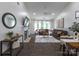 Open-concept living room with fireplace, television, and plenty of comfortable seating and natural light at 4637 Willow Glen Rd, Harrisburg, NC 28075