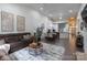 Open-concept living room and dining area flowing into the kitchen with comfortable seating at 4637 Willow Glen Rd, Harrisburg, NC 28075