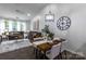 Open-concept living room and dining area boasting natural light, and comfortable seating at 4637 Willow Glen Rd, Harrisburg, NC 28075