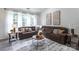 Cozy living room featuring comfortable seating, natural light, and stylish decor at 4637 Willow Glen Rd, Harrisburg, NC 28075