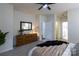Spacious main bedroom featuring carpet floors, a ceiling fan, and access to the en suite bathroom at 4637 Willow Glen Rd, Harrisburg, NC 28075