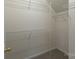 Walk-in closet featuring carpet floors and wire shelving for organization at 4637 Willow Glen Rd, Harrisburg, NC 28075