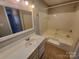 Bathroom featuring a shower-tub combo, toilet, and a sink with vanity at 5003 Sharon Rd # Q, Charlotte, NC 28210