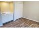 Bright bedroom featuring wood-look flooring, closet, and a sink with white cabinetry at 5003 Sharon Rd # Q, Charlotte, NC 28210