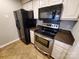Kitchen featuring stainless steel appliances, laminate countertops, and white cabinetry at 5003 Sharon Rd # Q, Charlotte, NC 28210
