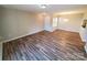 Open-concept living room with lots of natural light and vinyl floors, providing a warm and inviting space at 5003 Sharon Rd # Q, Charlotte, NC 28210