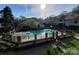 View of the fenced community pool and pool house at 5003 Sharon Rd # Q, Charlotte, NC 28210
