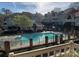 View of the fenced community pool and pool house at 5003 Sharon Rd # Q, Charlotte, NC 28210