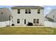 Well-maintained backyard with patio space, featuring a grill and egg chair at 5113 Saddleback Dr, Mount Holly, NC 28120