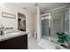 Stylish bathroom with a granite countertop, glass shower, and large walk-in closet at 5113 Saddleback Dr, Mount Holly, NC 28120