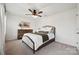 Serene bedroom featuring soft carpet, a ceiling fan, and classic furniture for a restful retreat at 5113 Saddleback Dr, Mount Holly, NC 28120