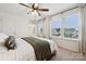 Bedroom bathed in natural light, highlighting a comfortable bed and view of the neighborhood at 5113 Saddleback Dr, Mount Holly, NC 28120