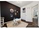 Well-lit bedroom features modern decor, hardwood floors, white walls, and large window at 5113 Saddleback Dr, Mount Holly, NC 28120