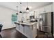 Kitchen with stainless steel appliances, granite counters, island, and pendant lighting, a chef's dream at 5113 Saddleback Dr, Mount Holly, NC 28120
