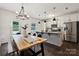 Kitchen dining area featuring stainless steel appliances, granite counters, pendant lighting and backyard access at 5113 Saddleback Dr, Mount Holly, NC 28120