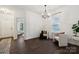 Bright living room featuring dark floors, white walls, and lots of natural light at 5113 Saddleback Dr, Mount Holly, NC 28120