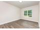 This bedroom boasts hardwood floors and a large window that provides great natural lighting at 5408 Unionville Brief Rd, Unionville, NC 28110