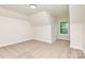 Bedroom with neutral walls, plush carpet, and a well-lit window creates a cozy and inviting atmosphere at 5408 Unionville Brief Rd, Unionville, NC 28110