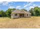 New home features a charming covered porch with natural wood columns and a well-manicured lawn at 5408 Unionville Brief Rd, Unionville, NC 28110