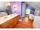 Bathroom with a freestanding tub, walk-in shower, a double vanity and a washer/dryer at 616 N Deal Ave, Newton, NC 28658