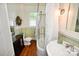 Bathroom featuring a classic sink, vintage fixtures, and wooden floors at 616 N Deal Ave, Newton, NC 28658