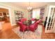 Elegant dining room with glass table, stylish chairs, and a large window at 616 N Deal Ave, Newton, NC 28658