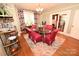 Elegant dining room with glass table, stylish chairs, and a large window at 616 N Deal Ave, Newton, NC 28658