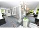 Cozy front porch showcasing outdoor seating, decorative accents, and ample natural light at 616 N Deal Ave, Newton, NC 28658