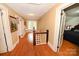 Upstairs hallway with hardwood floors, connecting bedrooms and featuring natural light at 616 N Deal Ave, Newton, NC 28658