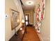 Hallway with wooden floors, decorative accents, and staircase at 616 N Deal Ave, Newton, NC 28658
