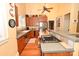 Well-appointed kitchen with stainless steel appliances, wooden cabinets, and tile countertops at 616 N Deal Ave, Newton, NC 28658