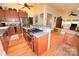 Open concept kitchen with stainless steel appliances and sightlines to living areas, great for entertaining at 616 N Deal Ave, Newton, NC 28658