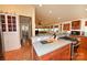Open-concept kitchen showcasing stainless steel appliances, wooden cabinetry, and seamless flow at 616 N Deal Ave, Newton, NC 28658