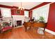 Living room with a brick fireplace, hardwood floors, and ample natural light perfect for relaxation at 616 N Deal Ave, Newton, NC 28658