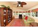 Comfortable living room with leafy ceiling fan, hardwood floors, and multiple windows bringing in natural light at 616 N Deal Ave, Newton, NC 28658