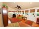Cozy sunroom with large windows, hardwood floors, and a leafy ceiling fan providing additional comfort at 616 N Deal Ave, Newton, NC 28658