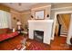 Cozy living room showcasing a decorative fireplace and classic hardwood floors at 616 N Deal Ave, Newton, NC 28658