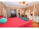 Comfortable main bedroom with a four-poster bed, wood floors, and natural light at 616 N Deal Ave, Newton, NC 28658