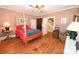 Comfortable main bedroom with a four-poster bed, wood floors, and natural light at 616 N Deal Ave, Newton, NC 28658