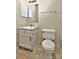 Cozy bathroom featuring a white vanity, tiled floors, and a medicine cabinet with a mirror at 6401 Windsor Gate Ln, Charlotte, NC 28215