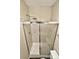 Bathroom with a shower featuring a clear glass door and tiled walls, offering a clean and modern aesthetic at 6401 Windsor Gate Ln, Charlotte, NC 28215