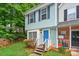 Charming townhome with blue siding, shutters, and a bright blue front door at 6401 Windsor Gate Ln, Charlotte, NC 28215