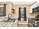 Stylish kitchen showcasing granite countertops, stainless steel appliances, and dark accents at 6401 Windsor Gate Ln, Charlotte, NC 28215